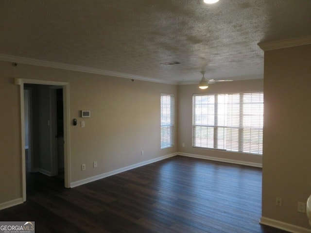 spare room featuring ornamental molding, dark hardwood / wood-style floors, a textured ceiling, and ceiling fan