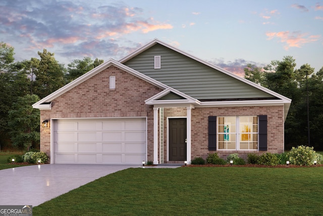 view of front facade with a garage and a lawn