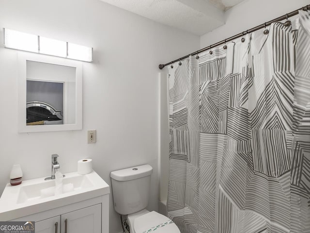 bathroom featuring vanity, a shower with curtain, and toilet