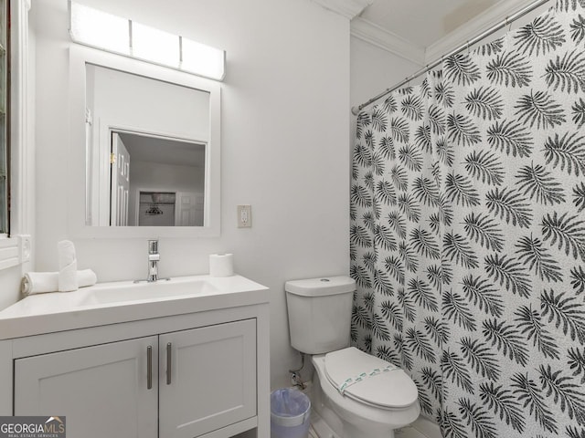 bathroom with ornamental molding, toilet, curtained shower, and vanity