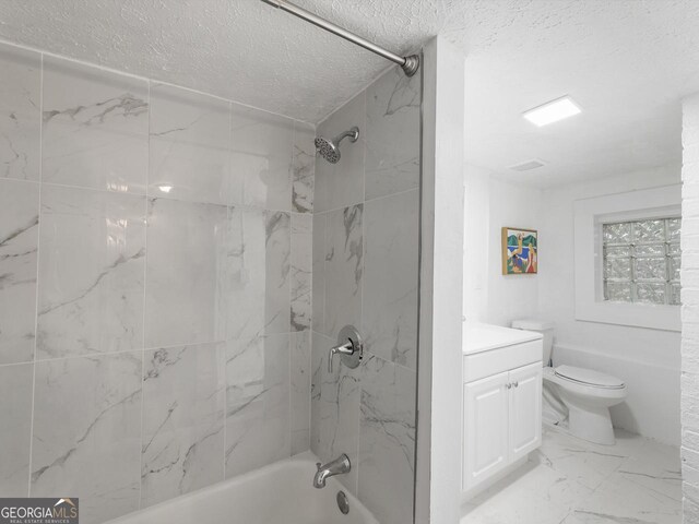 261 Fletcher St SW, Atlanta, GA 30315 - bathroom featuring a textured ceiling, marble finish floors, shower / washtub combination, toilet, and vanity