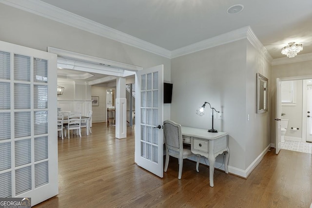 interior space featuring ornamental molding and wood-type flooring