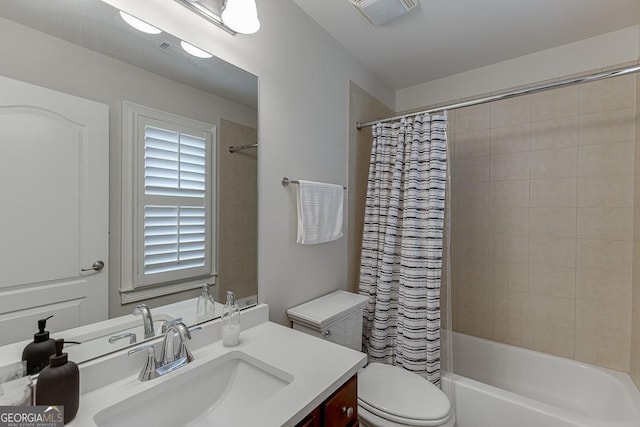 full bathroom featuring vanity, toilet, and shower / bathtub combination with curtain