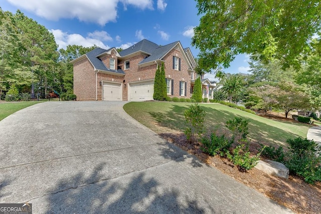 view of front of home with a garage and a front yard