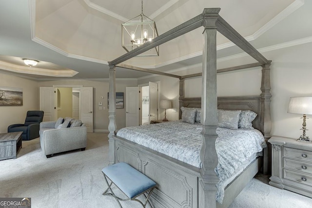 bedroom featuring ornate columns, ornamental molding, a raised ceiling, and light colored carpet