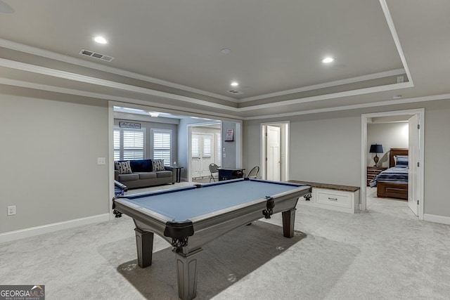 game room with a raised ceiling, ornamental molding, light colored carpet, and pool table