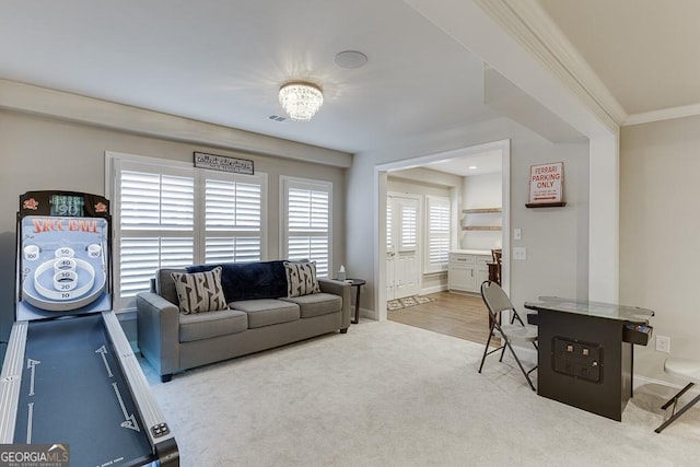 interior space with crown molding and carpet