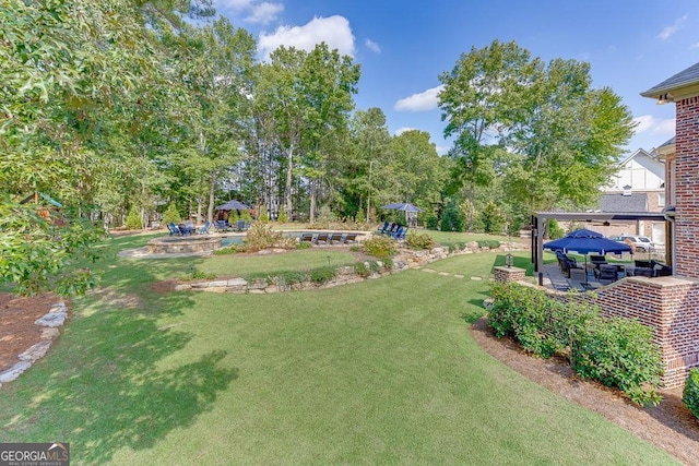 view of yard with a gazebo, a patio, and a playground