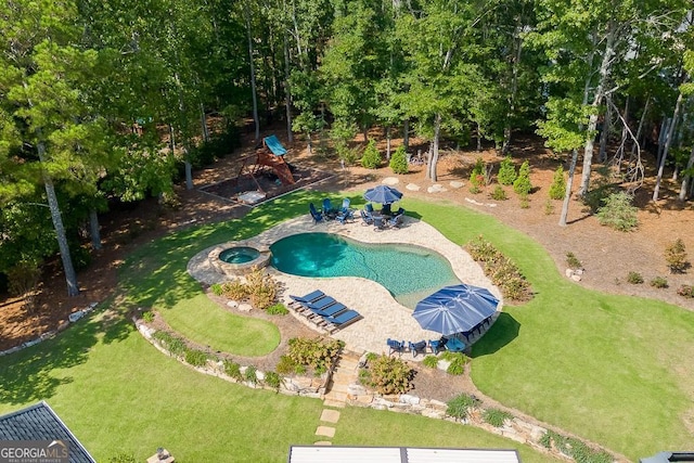 view of pool with an in ground hot tub, a yard, and a patio area