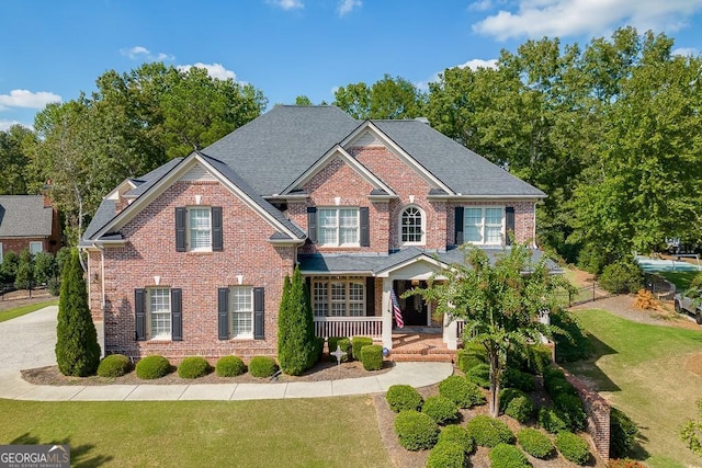 view of front of house featuring a front lawn and a porch