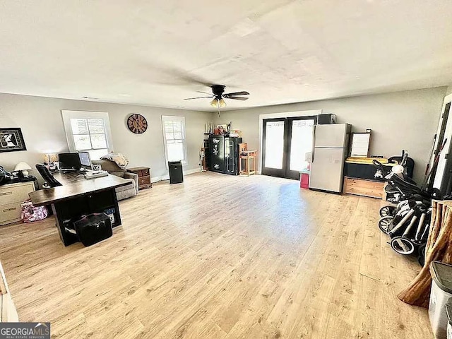 interior space featuring french doors, ceiling fan, and light wood-type flooring