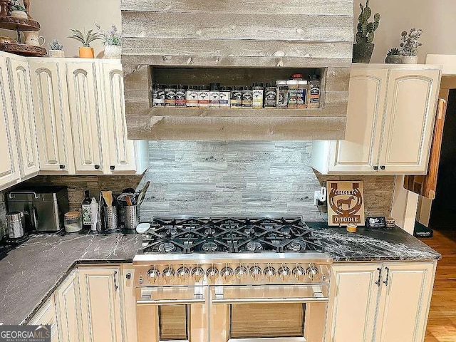 1150 Sutton Rd, Demorest, GA 30535 - kitchen with range with two ovens, backsplash, and dark countertops