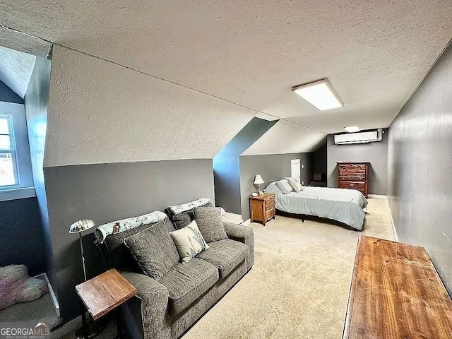 bedroom with lofted ceiling, carpet flooring, a wall mounted AC, and a textured ceiling