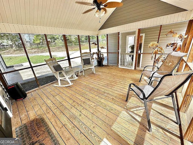 sunroom / solarium featuring wood ceiling, ceiling fan, and lofted ceiling