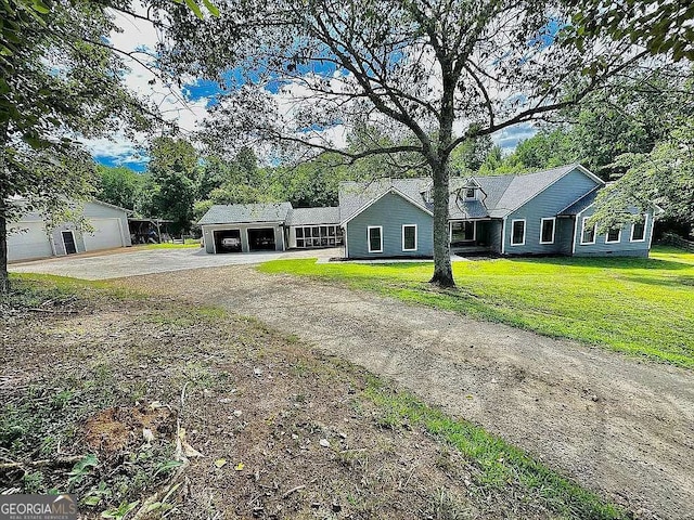 ranch-style house with a garage and a front yard