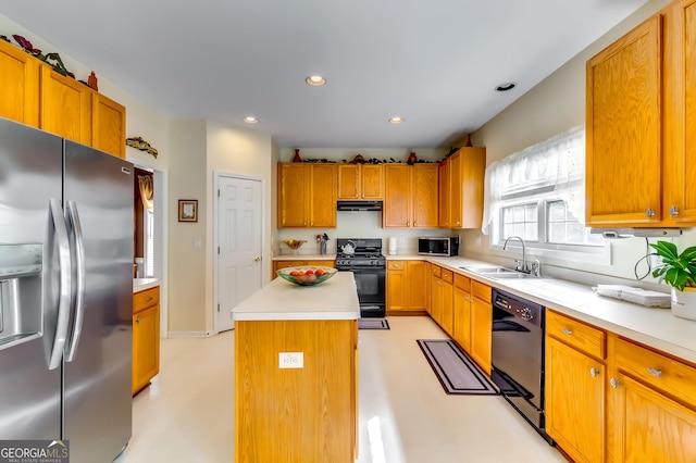 kitchen with sink, a kitchen island, and black appliances