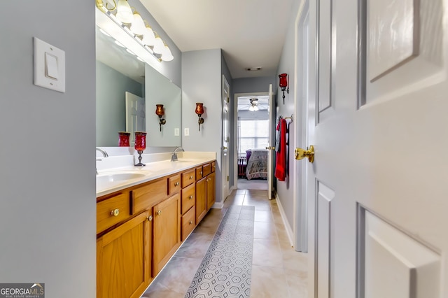 bathroom featuring ceiling fan, vanity, and tile patterned flooring