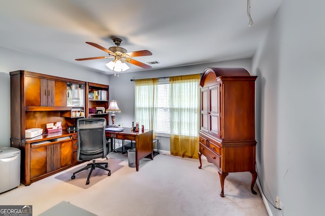 office featuring light carpet and ceiling fan