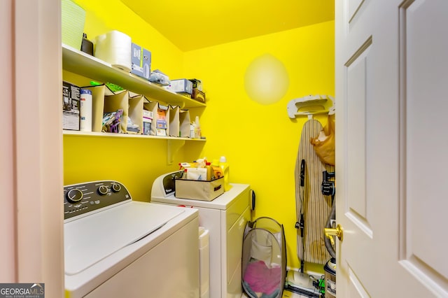 clothes washing area featuring washing machine and clothes dryer