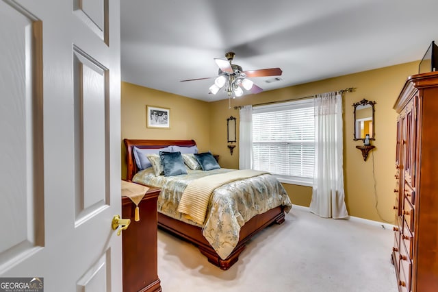 carpeted bedroom featuring ceiling fan