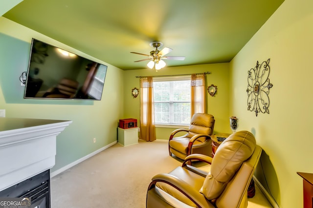 living area with ceiling fan