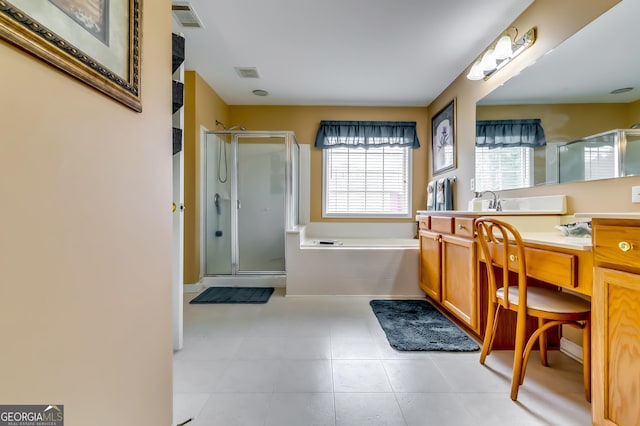 bathroom featuring shower with separate bathtub and vanity