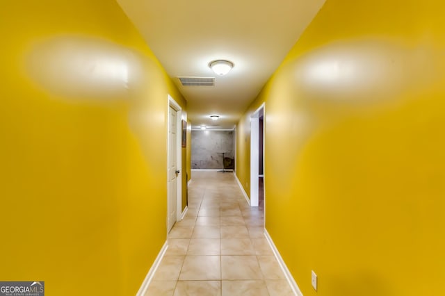 corridor featuring light tile patterned floors