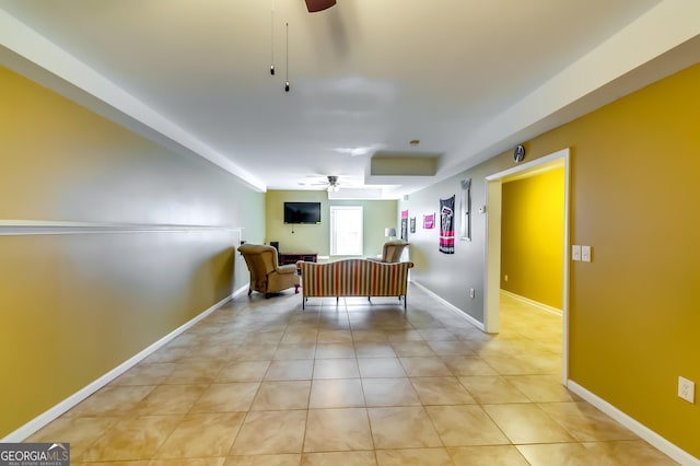 unfurnished room with light tile patterned flooring and ceiling fan