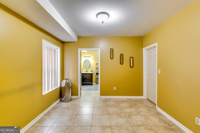 corridor with light tile patterned flooring