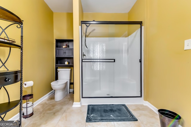 bathroom with walk in shower, toilet, and tile patterned flooring