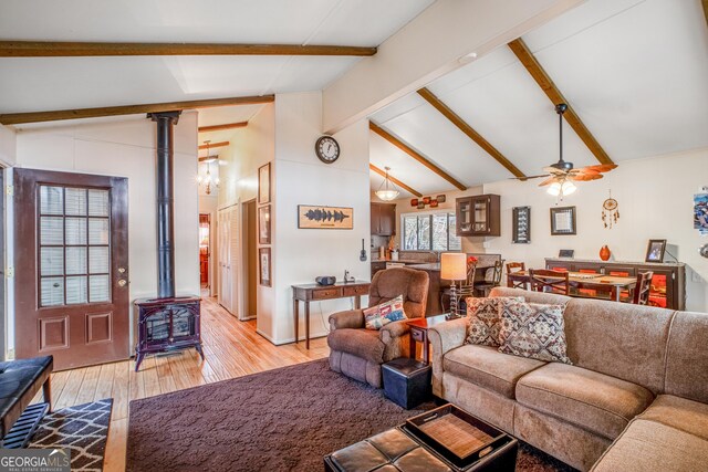 living room with beamed ceiling and light hardwood / wood-style flooring