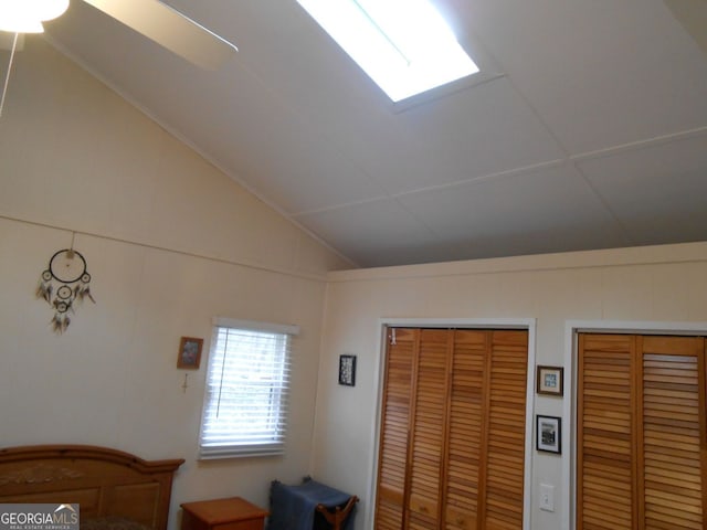 bedroom with vaulted ceiling, a closet, and ceiling fan