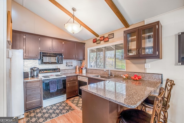 kitchen with pendant lighting, lofted ceiling with beams, black appliances, sink, and kitchen peninsula