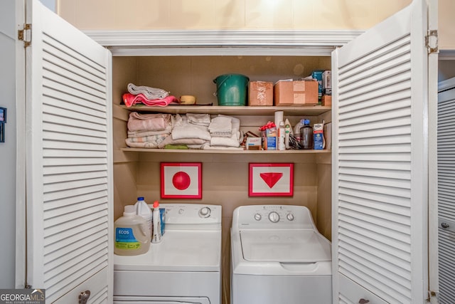 laundry room featuring washing machine and clothes dryer