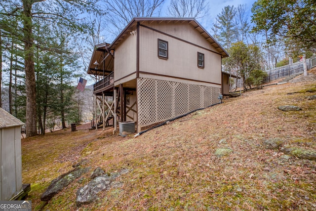 back of property featuring central AC unit