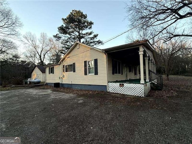 view of property exterior featuring a porch