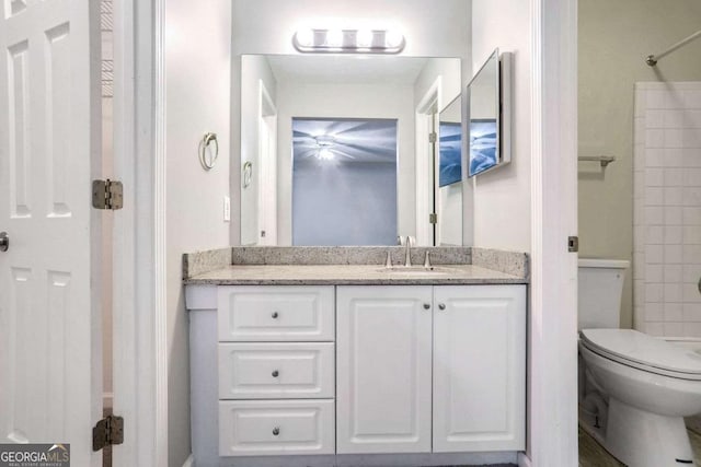 bathroom featuring vanity and toilet