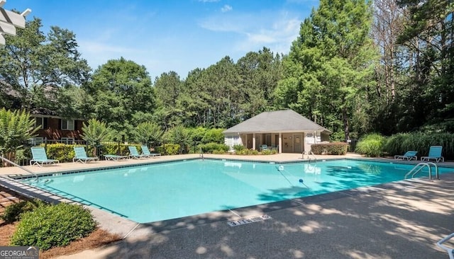 view of swimming pool featuring a patio area