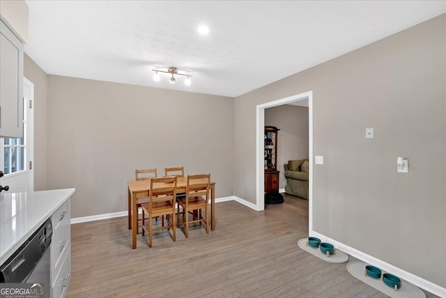 dining room with light hardwood / wood-style floors