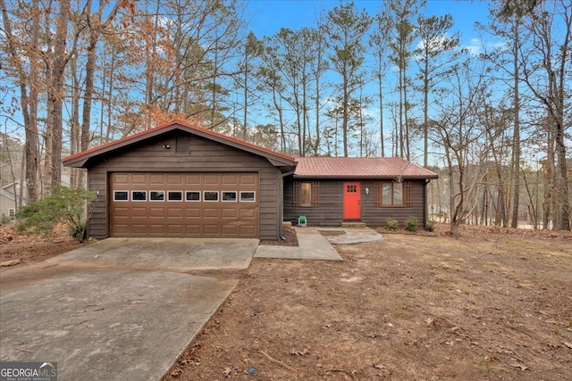 ranch-style house featuring a garage