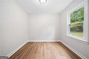 spare room featuring hardwood / wood-style floors