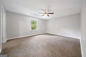 unfurnished room featuring ceiling fan