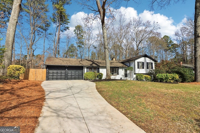 split level home featuring a garage and a front yard