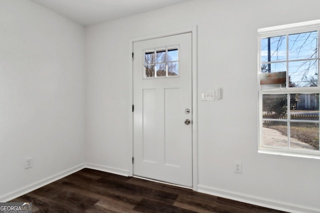 entryway with dark wood-type flooring and plenty of natural light