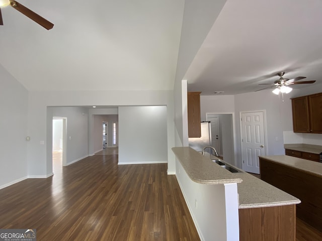 kitchen with ceiling fan, sink, and dark hardwood / wood-style floors