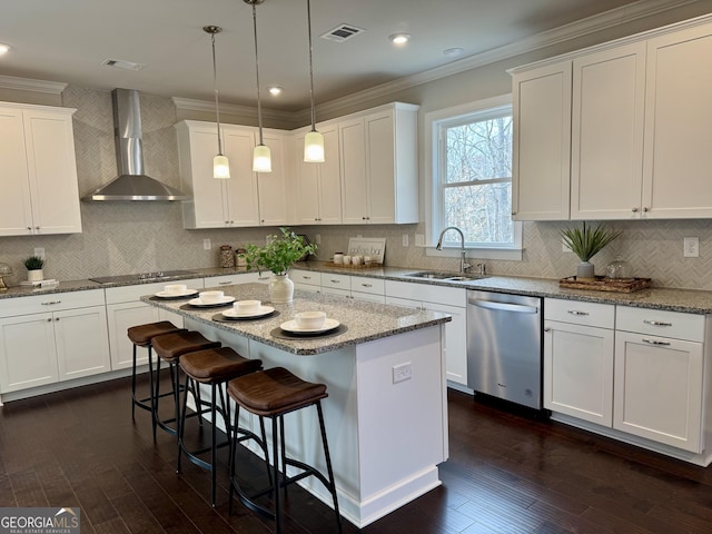 kitchen with black electric cooktop, a sink, visible vents, wall chimney range hood, and stainless steel dishwasher