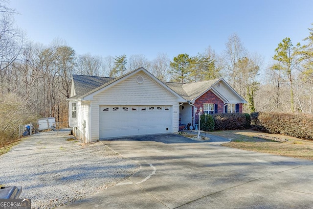 ranch-style home featuring a garage