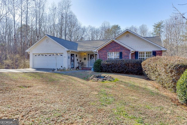 single story home with a garage and a front yard