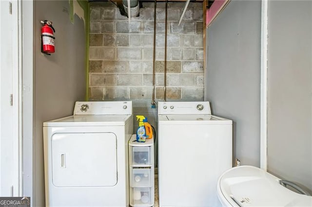 laundry room featuring washing machine and dryer