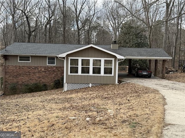 view of side of property with a carport